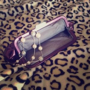 Purple Calvin Klein clutch